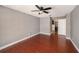 Bright living room featuring wood floors and a ceiling fan fixture at 16201 Country Crossing Dr, Tampa, FL 33624