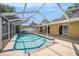 Refreshing pool in screened enclosure with ample deck space for lounging and entertaining at 16201 Country Crossing Dr, Tampa, FL 33624