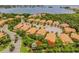 Aerial view of residential community, showcasing well maintained lawns and landscaping at 184 Banyan Bay Dr, St Petersburg, FL 33705