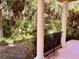 Private backyard area surrounded by lush greenery and mature trees at 184 Banyan Bay Dr, St Petersburg, FL 33705