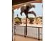 A pleasant balcony view shows well-maintained and tidy landscaping, light colored homes and palm trees at 184 Banyan Bay Dr, St Petersburg, FL 33705