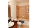 Neutral-tiled bathroom featuring a shower-tub combo, dark vanity, and sink at 184 Banyan Bay Dr, St Petersburg, FL 33705
