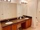 Bathroom featuring a dual vanity, granite countertops, and tile flooring at 184 Banyan Bay Dr, St Petersburg, FL 33705