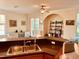 Open kitchen with a breakfast bar overlooking the living area, featuring granite countertops at 184 Banyan Bay Dr, St Petersburg, FL 33705