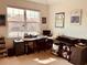 Brightly lit home office space with a desk and shelving, offering an ideal work-from-home environment at 184 Banyan Bay Dr, St Petersburg, FL 33705