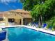 Community swimming pool with inviting blue water and plenty of seating for residents to relax and enjoy the sun at 184 Banyan Bay Dr, St Petersburg, FL 33705