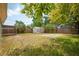 Large backyard features a storage shed and some mature trees at 1858 Oregon Ave Ne, St Petersburg, FL 33703