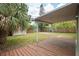 Spacious backyard featuring a covered patio and storage shed at 1858 Oregon Ave Ne, St Petersburg, FL 33703