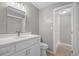 Modern bathroom featuring a vanity with a white countertop, and a tiled shower at 1858 Oregon Ave Ne, St Petersburg, FL 33703