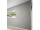 Bedroom features a large window with view of leafy, green trees at 1858 Oregon Ave Ne, St Petersburg, FL 33703