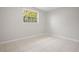 A bright bedroom with fresh paint and neutral tile floors at 1858 Oregon Ave Ne, St Petersburg, FL 33703