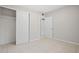 Bedroom with neutral tile flooring and large closet with sliding doors at 1858 Oregon Ave Ne, St Petersburg, FL 33703