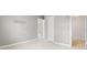 Hallway features fresh paint, tile floors, and access to updated bathroom at 1858 Oregon Ave Ne, St Petersburg, FL 33703