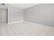 Spacious living room featuring tile flooring, neutral colors, and ample natural light at 1858 Oregon Ave Ne, St Petersburg, FL 33703