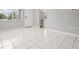 Bright and airy living area showcasing tile floors, a front entry door, and modern finishes at 1858 Oregon Ave Ne, St Petersburg, FL 33703