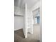Walk-in closet with built-in shelving and carpet, providing ample storage space at 1864 Clearbrooke Dr, Clearwater, FL 33760