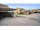 Exterior view showcasing a covered carport and well-maintained landscaping at 1864 Clearbrooke Dr, Clearwater, FL 33760