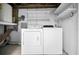 Laundry room with a washer and dryer, shelving, and water heater at 1864 Clearbrooke Dr, Clearwater, FL 33760