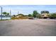 Large parking lot providing ample parking, surrounded by mature trees at 1864 Clearbrooke Dr, Clearwater, FL 33760