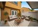 Outdoor living space with comfortable seating, potted plants, and a striped rug at 1864 Clearbrooke Dr, Clearwater, FL 33760