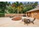 Well-maintained pool area with patio seating, landscaping, and changing rooms for convenience at 1864 Clearbrooke Dr, Clearwater, FL 33760