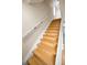 Classic staircase with wooden steps and white railing, leading to the upper level of the home at 1864 Clearbrooke Dr, Clearwater, FL 33760