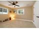 Comfortable bedroom with a ceiling fan, neutral walls and carpet, and plenty of natural light at 1891 Harmony Dr, Clearwater, FL 33756