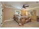 Comfortable bedroom with carpet, large window, ceiling fan and coordinating furnishings at 1891 Harmony Dr, Clearwater, FL 33756