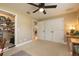 Bedroom featuring double closets, natural lighting, and a view of the dining room at 1891 Harmony Dr, Clearwater, FL 33756