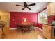 Cozy dining area with a round wooden table, hardwood floors, and ample natural light at 1891 Harmony Dr, Clearwater, FL 33756
