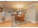 Open dining room with hardwood floors, traditional chandelier, with easy access to the living areas at 1891 Harmony Dr, Clearwater, FL 33756