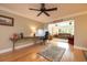 Inviting home office space with hardwood floors, natural light, and an open view to the connected living room at 1891 Harmony Dr, Clearwater, FL 33756