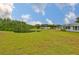 Beautiful backyard featuring a tranquil pond and lush greenery at 1902 Hanson Ct # 308, Sun City Center, FL 33573