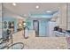 Bright kitchen boasts white cabinets, modern appliances, and granite counters at 1902 Hanson Ct # 308, Sun City Center, FL 33573
