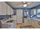 Functional laundry room with white cabinets, countertops, and modern washer/dryer at 1902 Hanson Ct # 308, Sun City Center, FL 33573