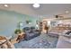 Inviting living room with modern furniture, decor, and an open view of the kitchen at 1902 Hanson Ct # 308, Sun City Center, FL 33573
