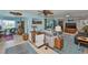 Open living room with tile floors and decorative lamps, furniture and accents at 1902 Hanson Ct # 308, Sun City Center, FL 33573
