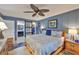 Well-lit main bedroom featuring barn-style door leading to the closet and bathroom at 1902 Hanson Ct # 308, Sun City Center, FL 33573