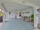 Inviting covered outdoor patio with comfortable seating, perfect for relaxing and enjoying the outdoors at 1902 Hanson Ct # 308, Sun City Center, FL 33573