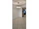 The dining area features tile floors and a modern light fixture near the kitchen at 2017 Skimmer W Ct # 413, Clearwater, FL 33762