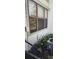 Exterior view of the home with a window and garden at 2017 Skimmer W Ct # 413, Clearwater, FL 33762
