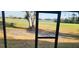 View of the golf course and water from the screened-in patio at 2017 Skimmer W Ct # 413, Clearwater, FL 33762