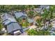 Aerial view of the charming home featuring a well-maintained backyard and mature trees at 231 15Th Ne Ave, St Petersburg, FL 33704