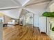 Bright attic space featuring hardwood floors, white paneled walls, beamed ceilings and a comfortable seating area at 231 15Th Ne Ave, St Petersburg, FL 33704