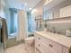 Bright bathroom featuring a shower/tub, modern vanity with marble countertop, and stylish fixtures at 231 15Th Ne Ave, St Petersburg, FL 33704