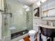This bathroom has a glass enclosed shower with rain shower head and a modern vanity at 231 15Th Ne Ave, St Petersburg, FL 33704