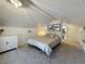 Bright bedroom with plank ceilings, carpet, closet, and a large window overlooking the yard at 231 15Th Ne Ave, St Petersburg, FL 33704