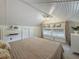 Bedroom featuring carpet, white plank ceiling, and a window overlooking the yard at 231 15Th Ne Ave, St Petersburg, FL 33704