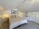 Bedroom featuring carpet, white plank ceiling, storage, and a window overlooking the yard at 231 15Th Ne Ave, St Petersburg, FL 33704