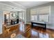 Dining room showcases a modern light fixture, stylish furniture, and shining hardwood floors at 231 15Th Ne Ave, St Petersburg, FL 33704